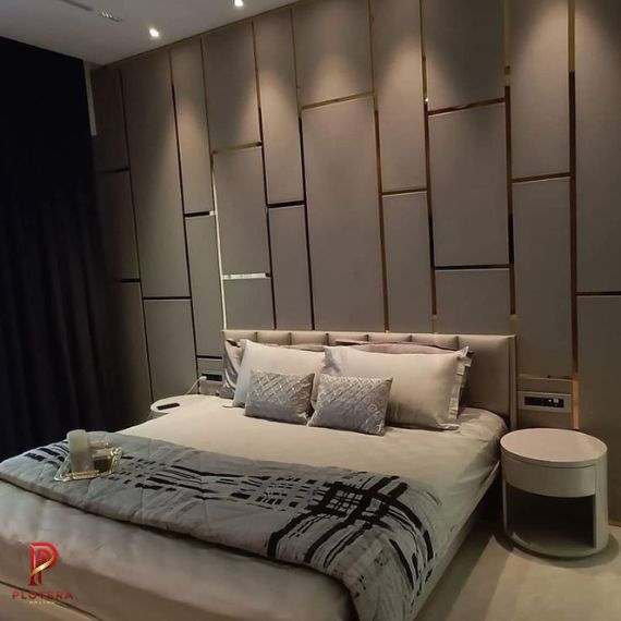 Modern bedroom featuring textured geometric wallpaper and premium interior decor. Ideal inspiration for stylish home interiors.