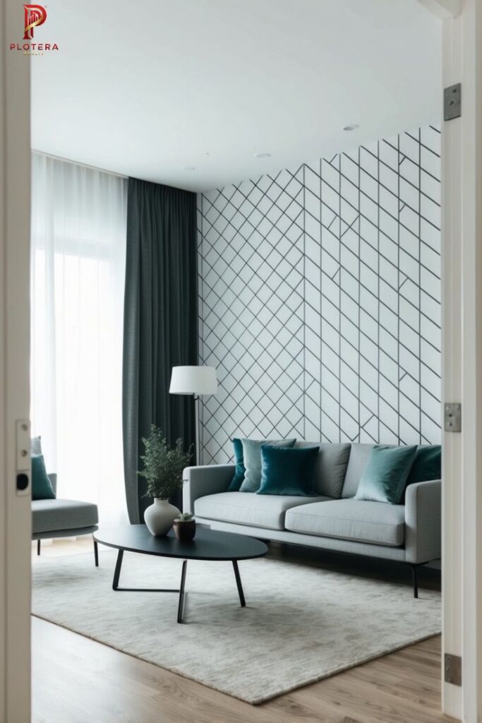 Minimalist living room interior showcasing a grey sofa and a bold geometric Scandinavian wallpaper with a black diagonal grid pattern. The space is accented with teal cushions and a black oval coffee table.